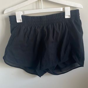 Black Athleta mesh racer run short. Size Medium. 4in.